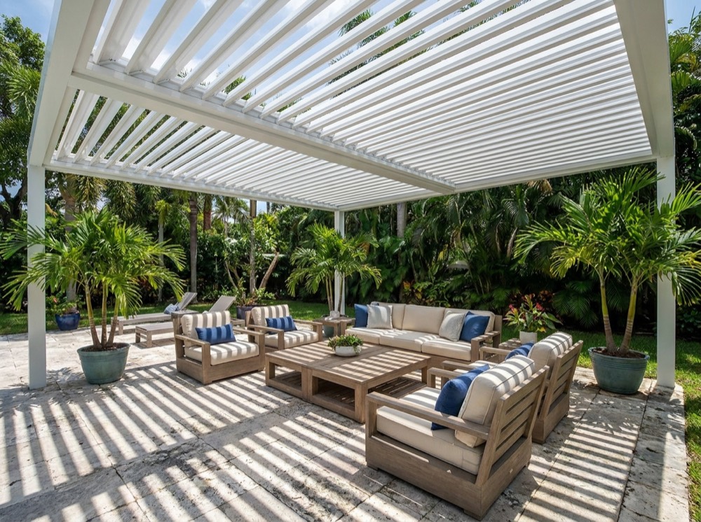 Louvered pergola over a stone patio in a Florida backyard